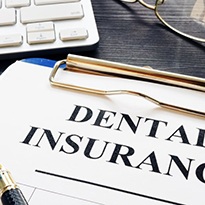 dental insurance form on a clipboard 